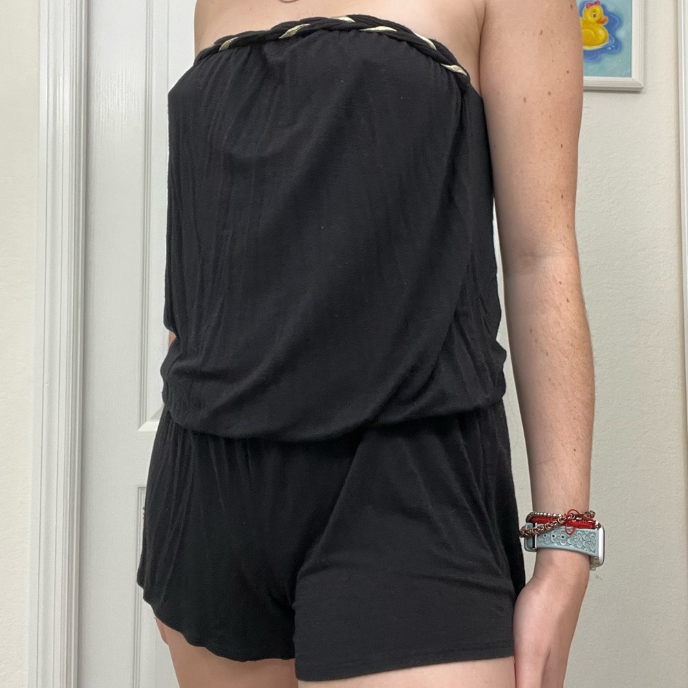 Black romper with gold detailing